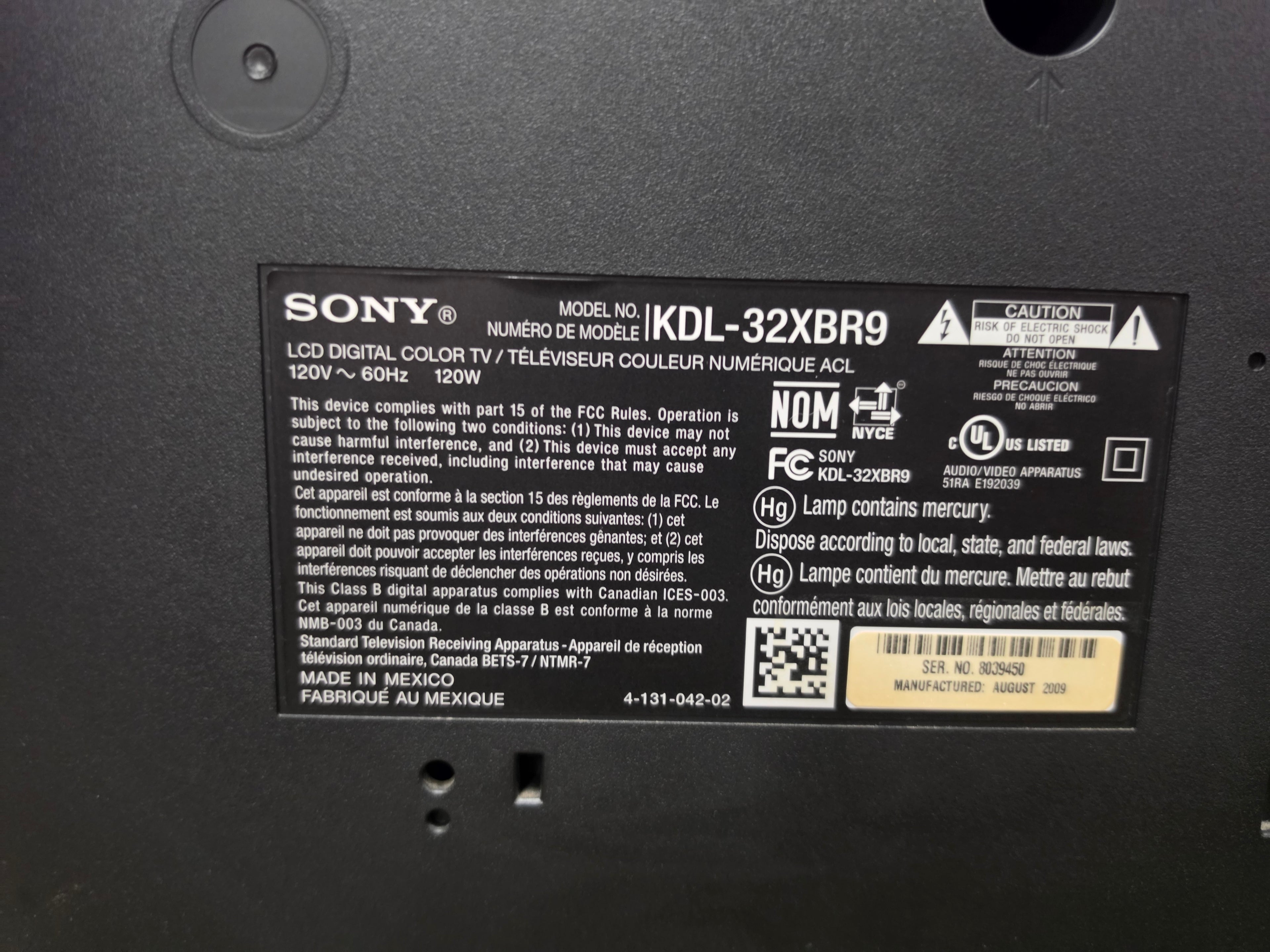 Close-up of the Sony Bravia KDL-32XBR9 model and specifications label on the rear panel.