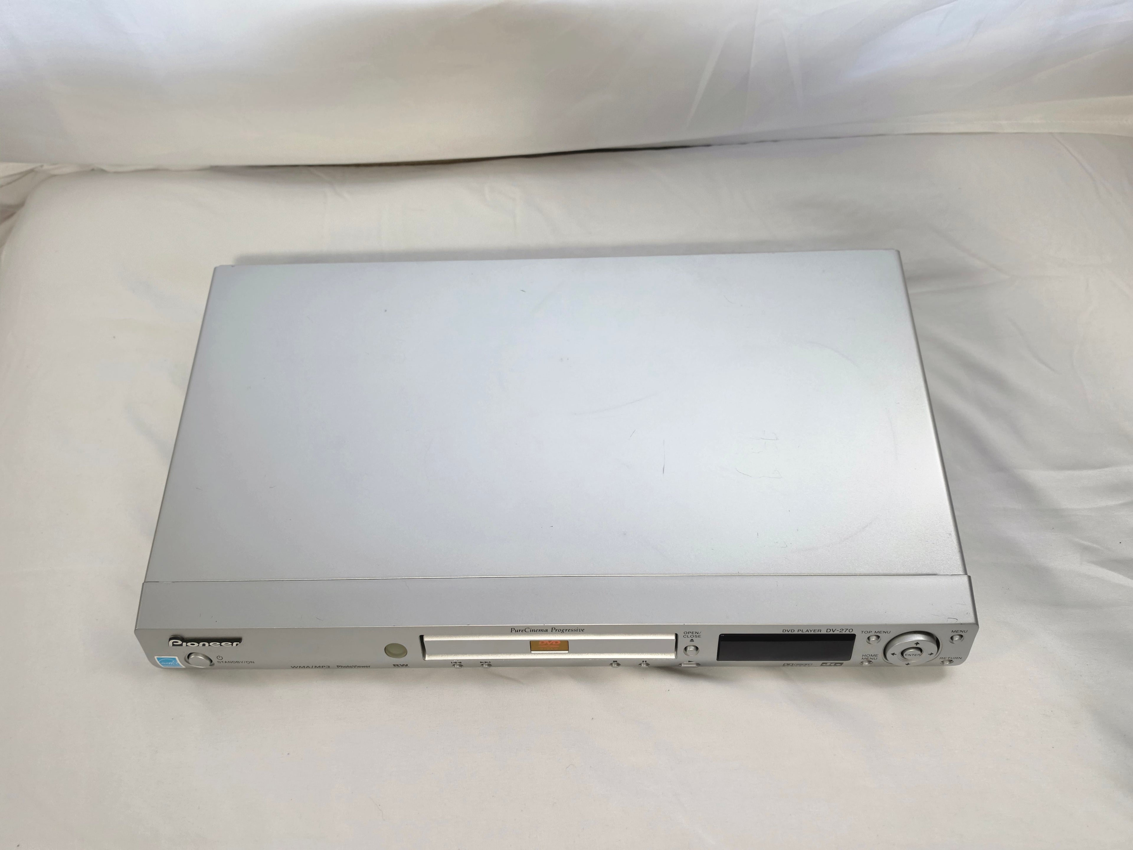 Top view of the slim silver Pioneer DV-270 DVD player.