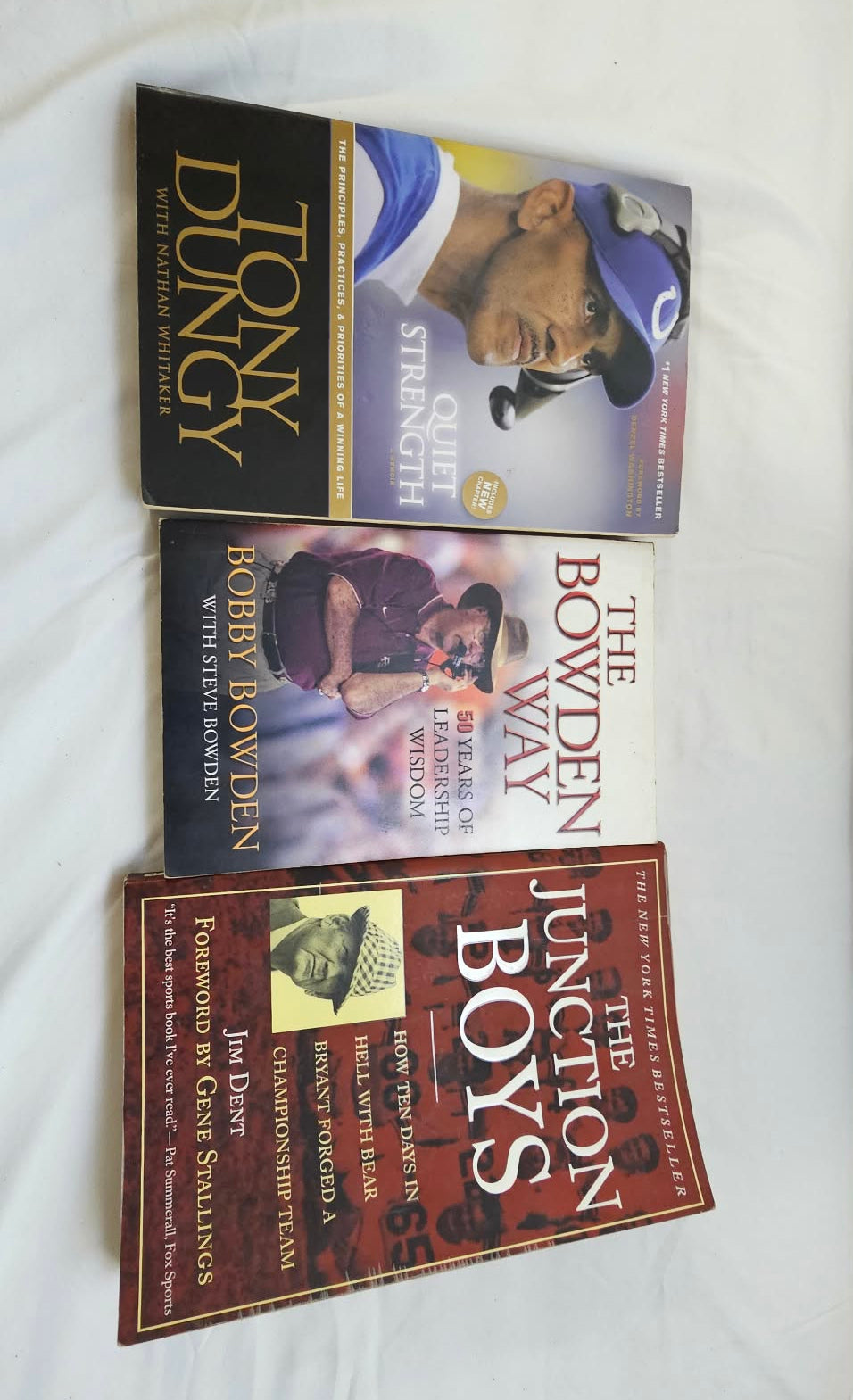 Tony Dungy, Bobby Bowden, and Junction Boys football books shown together.