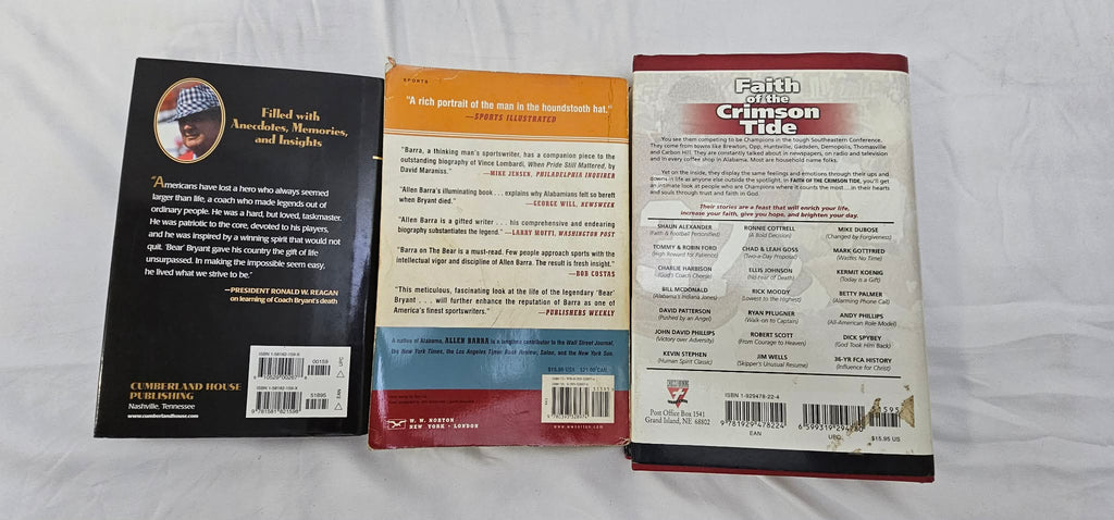 Back covers of three pre-owned football books arranged side by side.