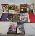 Twelve pre-owned Alabama football, coaching, and sports books arranged together on a white bed.
