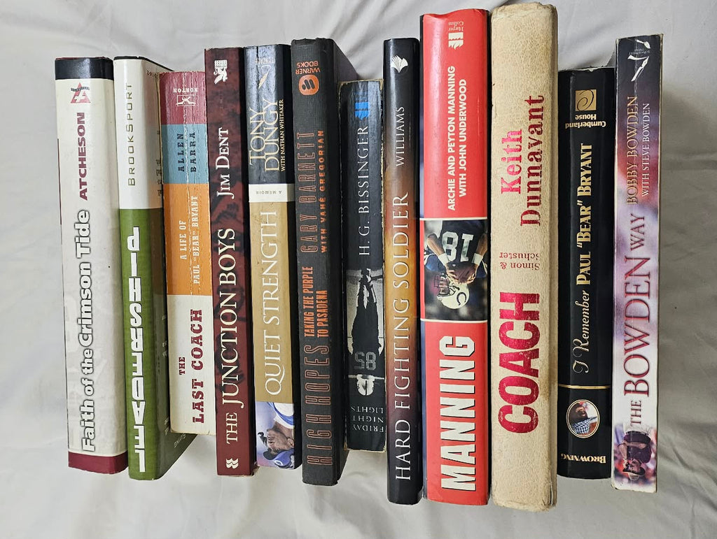 Spines of the twelve-book Alabama football, coaching, and sports biography bundle.