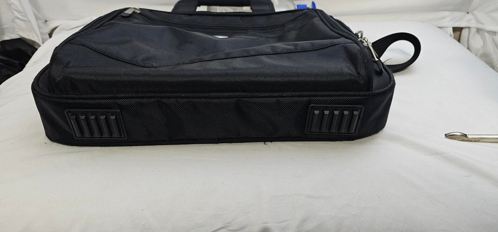 Bottom view of the black Dell laptop briefcase showing the two rectangular rubber feet.