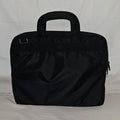 Rear exterior of the black Targus SafePORT laptop briefcase with padded top handles.
