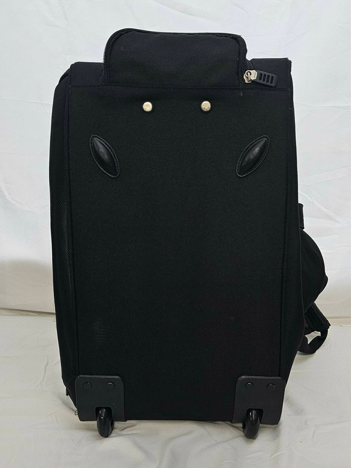 Bottom of Jeep rolling duffel showing wheel housings and protective feet